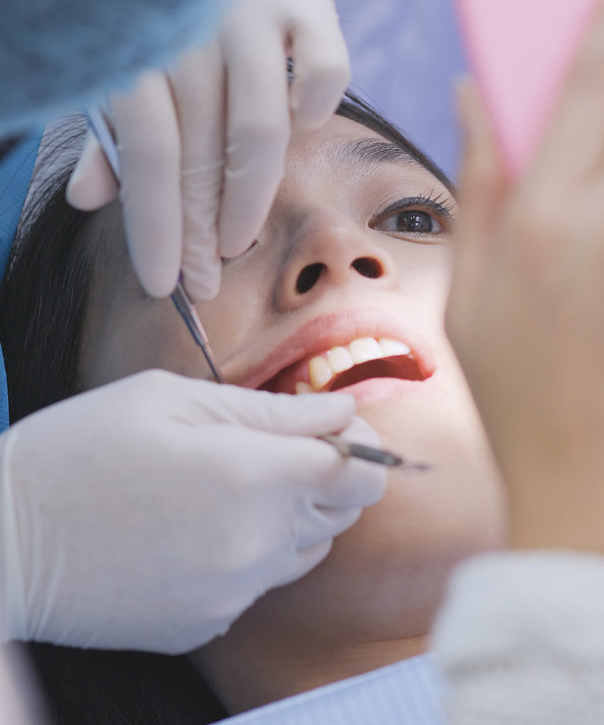 patient undergo dental treatment in dental clinic 3Z65WHQ